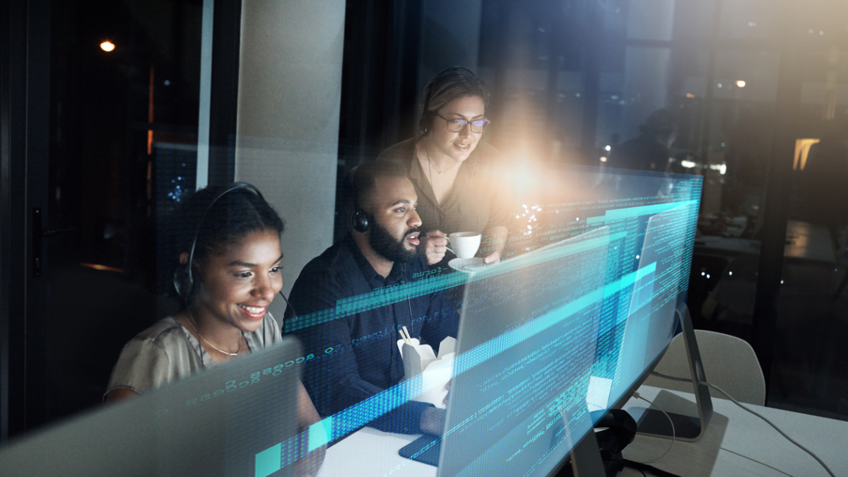 High angle shot of an IT support team working the late shift in their office